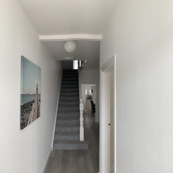 Large hallway and stairs leading to 3 bedrooms on the 1st floor, 4th bedroom on the ground floor